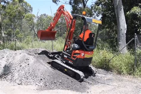 mini excavator going down steep hill|steep slope mini excavator.